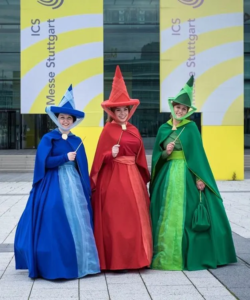 women smiling wearing halloween costumes