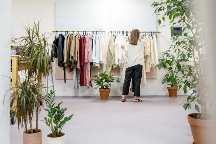 women picking up clothes