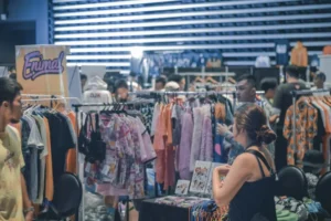 people picking up hanging clothes