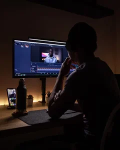 boy sitting in front of screen 