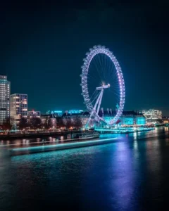 night view of a sea with big wheel